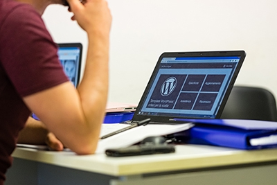 Man looking at his computer searching for Columbus Ohio website design