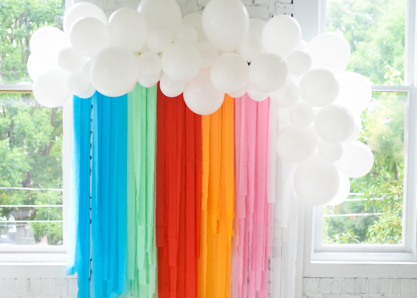 rainbow party streamers with white balloons